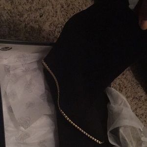 Black suede booties with gold trimming